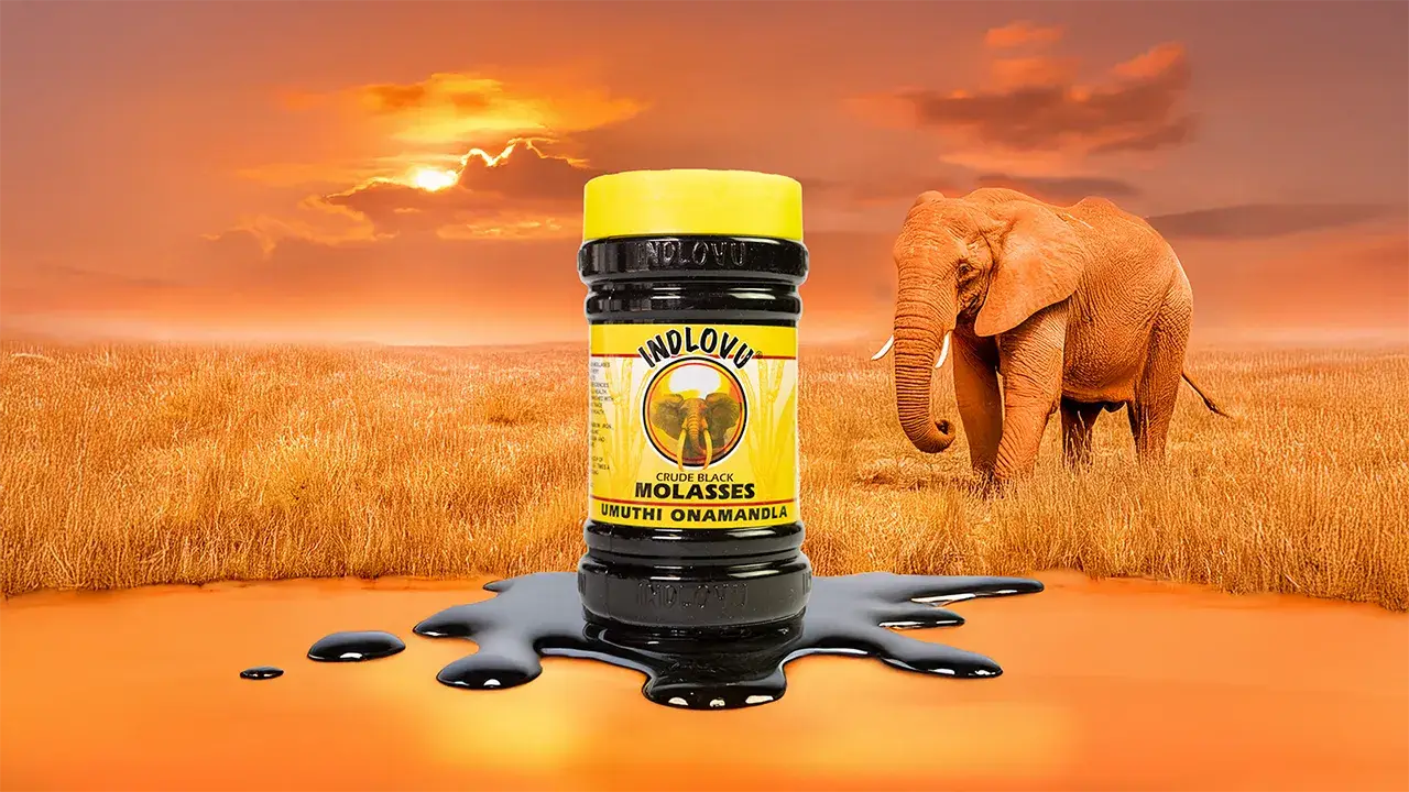 Indlovu molasses jar with elephant, sunset background